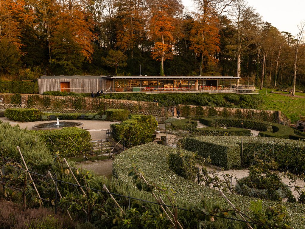 The glow of autumn leaves above the Garden Café with the Parabola in the foreground