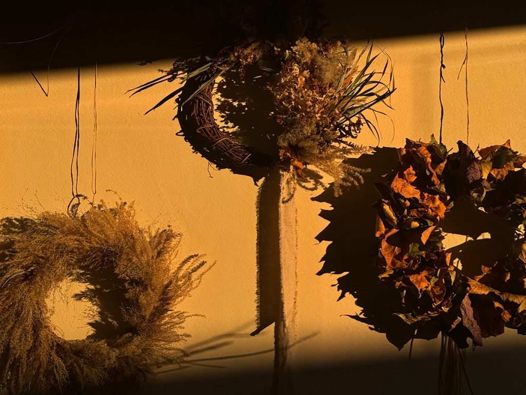 Wreaths adorned with foraged botanicals from the gardens 